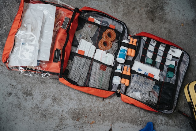A hiker holding a small first aid kit while standing in front of a forest reserve in Malaysia Malaysia malaysia latest news travel news malaysianews.my