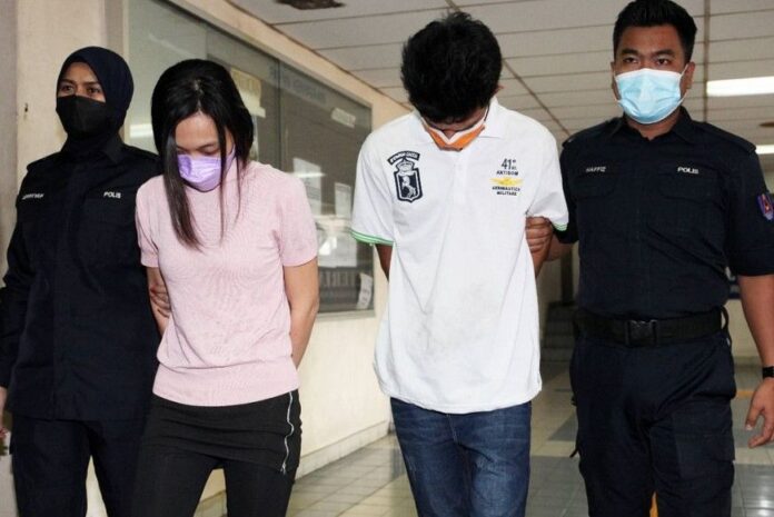 Khor Swee Boon and Ng Hui Yee being led into the Kuala Lumpur Magistrate's Court on Monday January 16th malaysia latest news sport news malaysianews.my