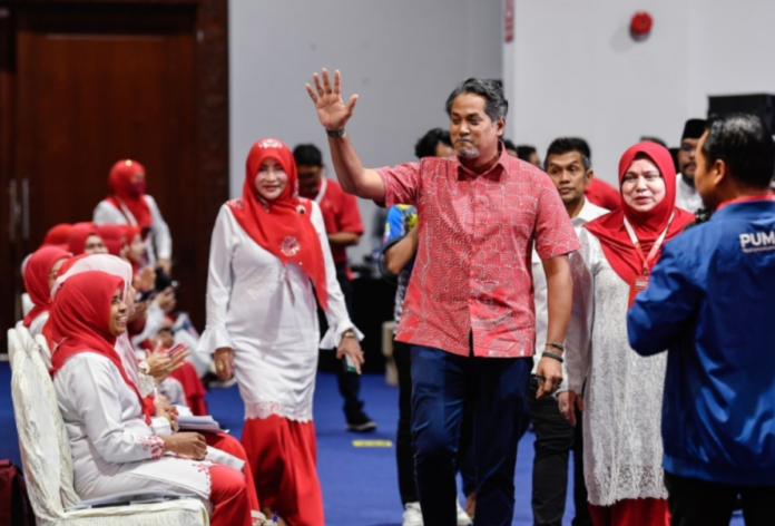 Khairy Jamaluddin looking happy as he greets an MP malaysia latest news sport news malaysianews.my