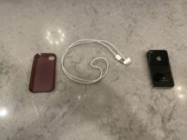 An iPhone 4 caught fire while charging on a kitchen counter in a Cincinnati, Ohio home, narrowly avoiding a house fire (burnt apple iphone 4 with charger)