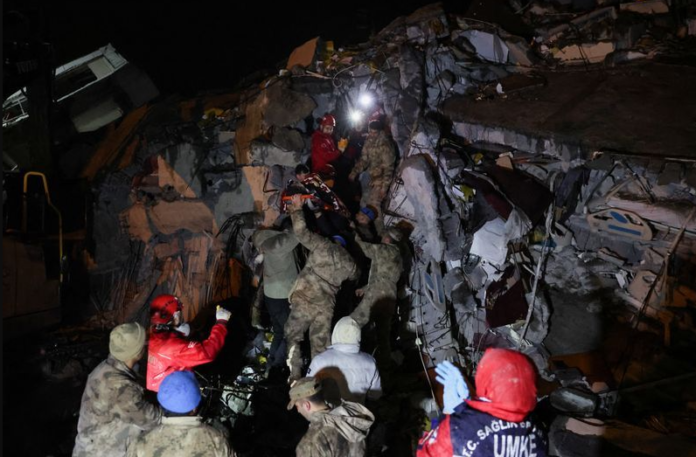 A woman is rescued from the rubble of a collapsed hospital following an earthquake in Iskenderun, Turkey. malaysia latest news turkey news malaysianews.my Turkey earthquake news.
